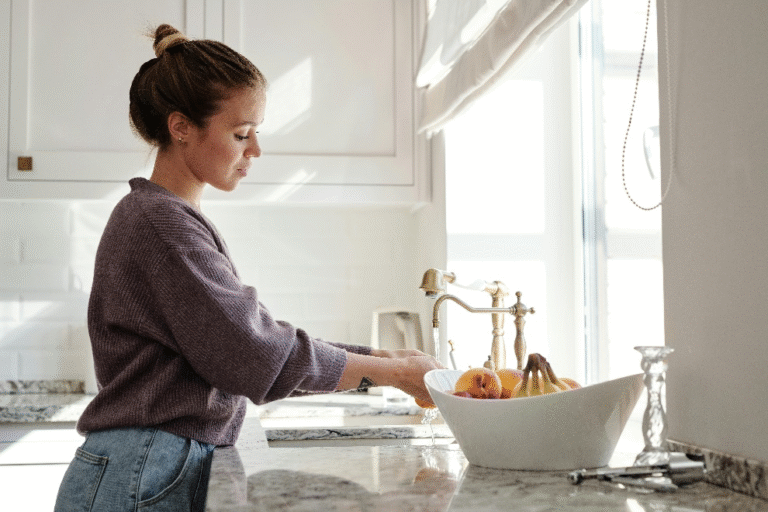 A woman busy working in her spotless kitchen